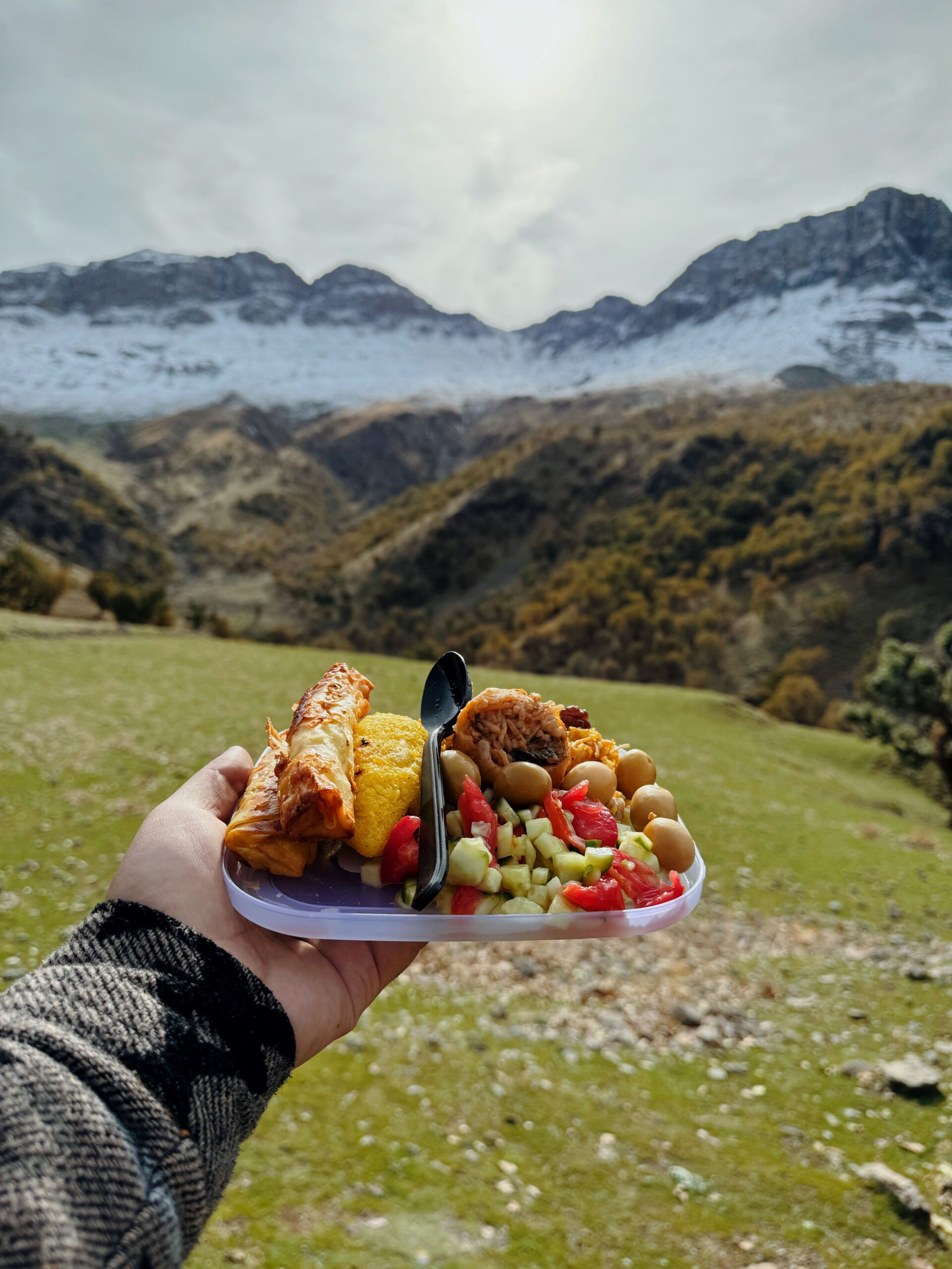 A delicious camping meal held against a backdrop of mountains in Ranya, Iraq.